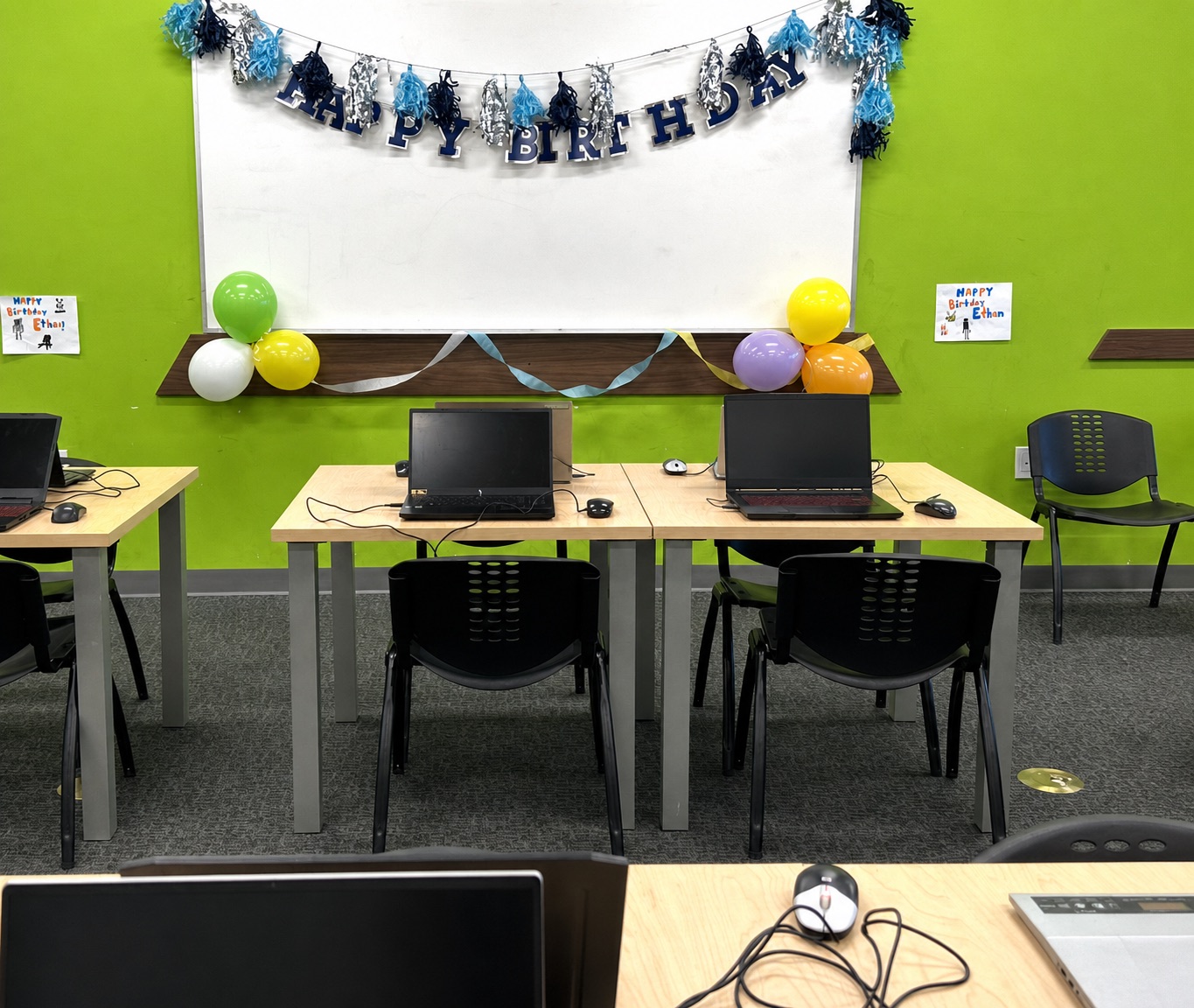 Laptop gaming stations decorated for a birthday party