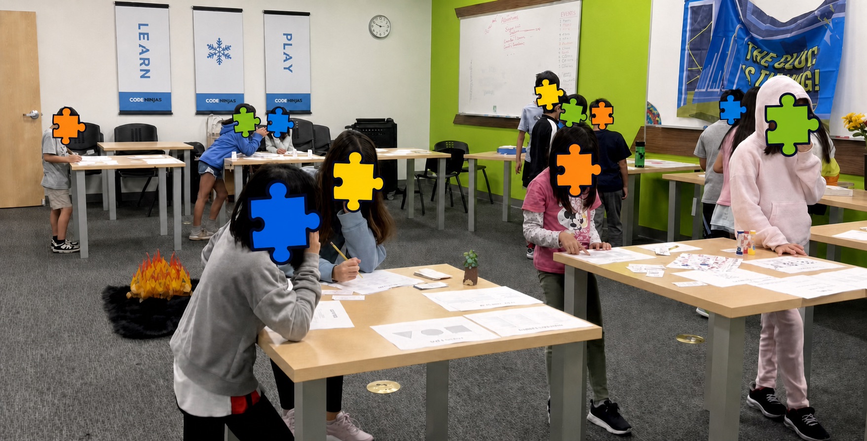 Kids working together at STEM challenge stations with colorful puzzle pieces covering their faces for privacy